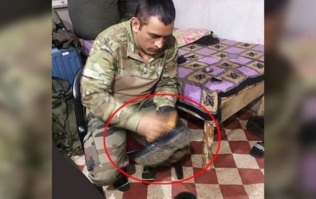 MS Dhoni spotted polishing military boots in occupied Kashmir