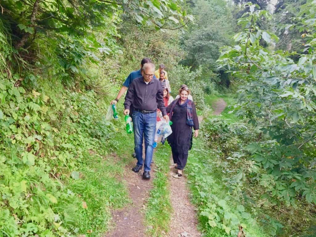 President Alvi spotted picking up trash on hiking trip