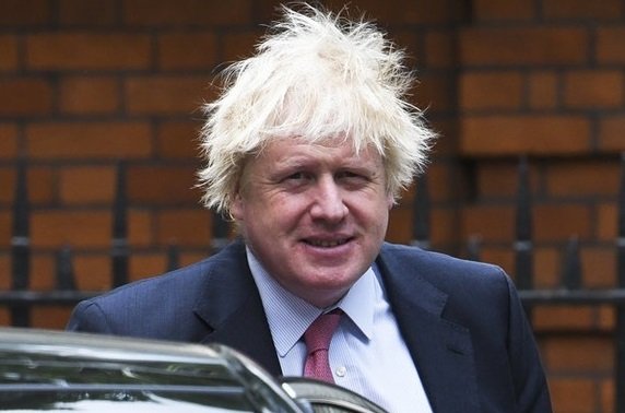 ‘I do brush my hair’: Boris Johnson apologises for messy hair