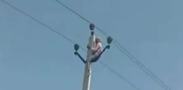60-year-old man climbs electric pole after children object to second marriage