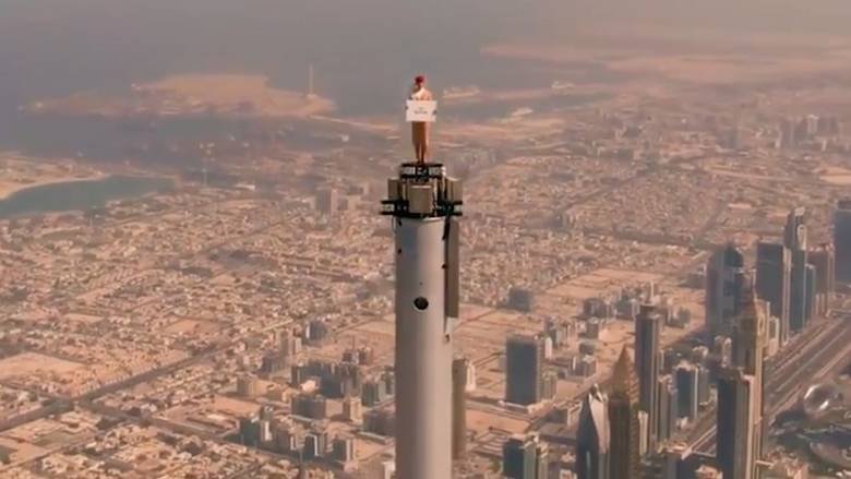 VIDEO: Emirates ‘flight attendant’ on top of Burj Khalifa to celebrate UK travel rules change