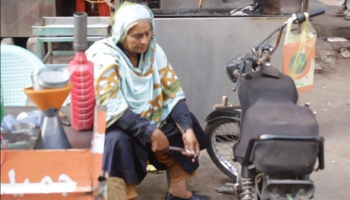 Woman in Karachi fixes motorcycles to earn living