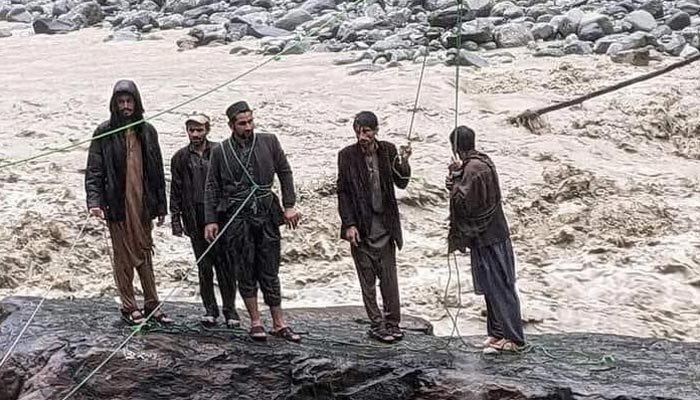 Four friends waiting to be rescued swept away by the flood
