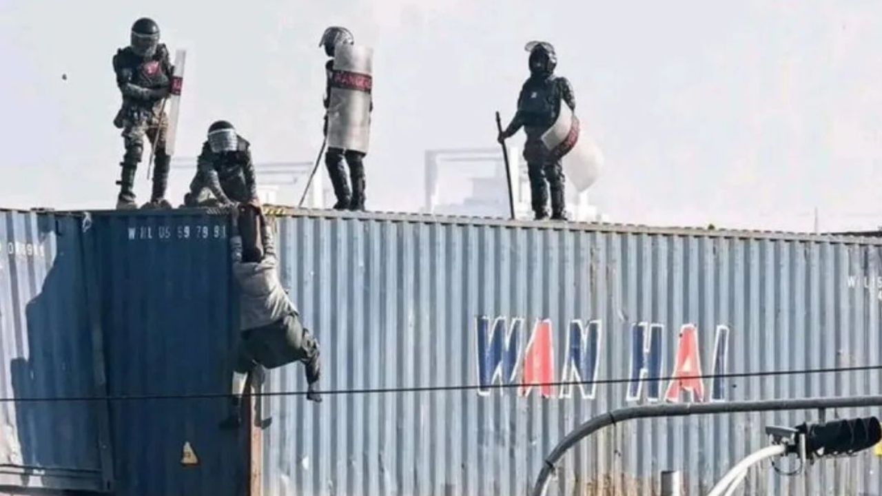 Watch: Law enforcement personnel kick PTI supporter down from three-storey container